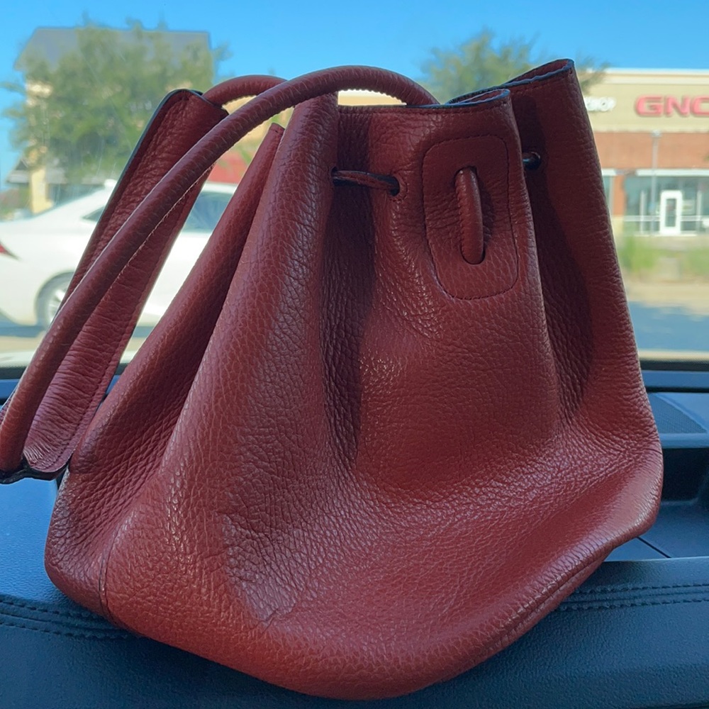 Rabeanco orange bucket bag. New. Never worn.